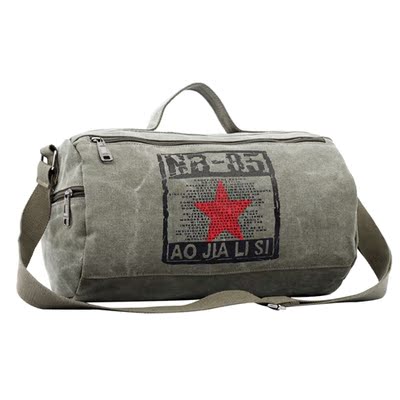 旅行包男圆筒包帆布女手提包短途轻便装衣服的